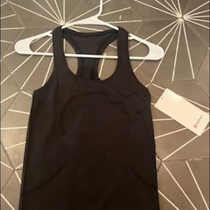 Black lululemon race length swiftly racerback tank top size 4